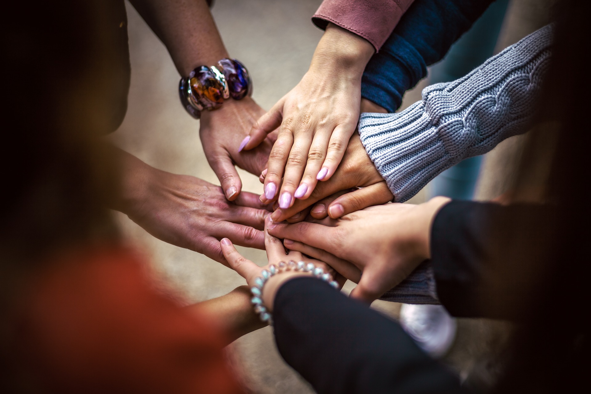 Community members joining hands in unity